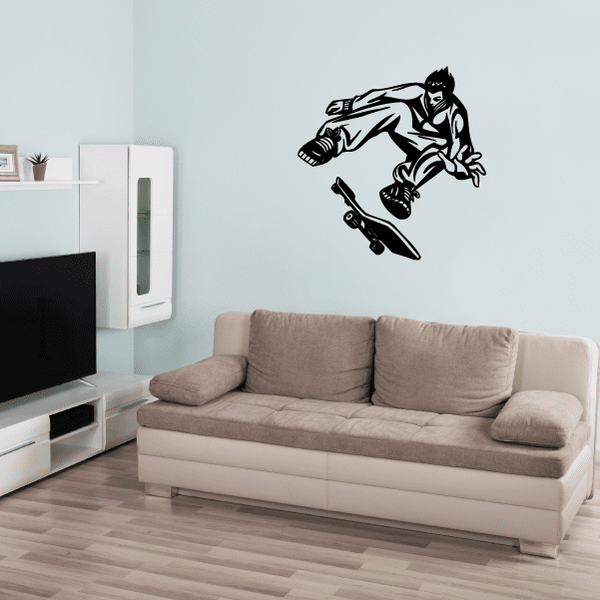 Skateboarding wall decal with black skateboarder riding a skateboard silhouette.