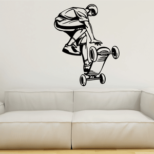 Skateboarding wall decal: black-and-white skateboarder figure with skateboard