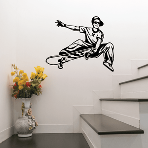 Skateboarder wall decal with a black figure riding a skateboard