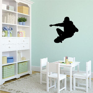 Vinyl skateboard wall decal with black skateboarder silhouette, stencil style