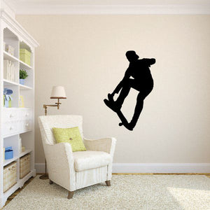 Skateboarding wall decal, black silhouette of a skater mid-jump