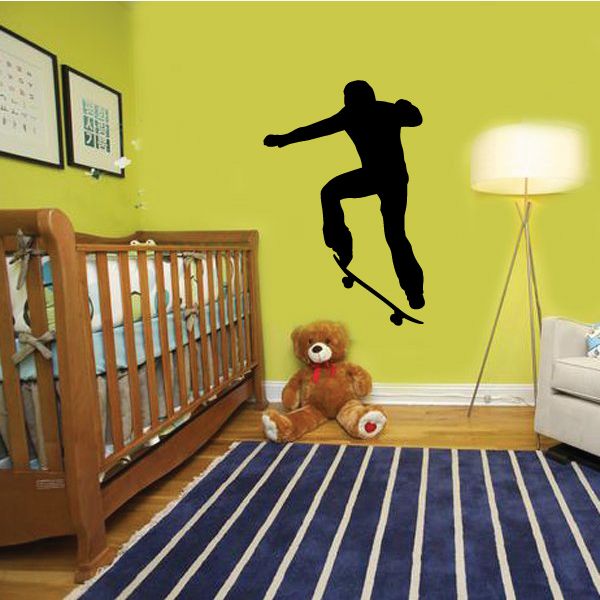 Skateboarding wall decal with black skateboarder silhouette