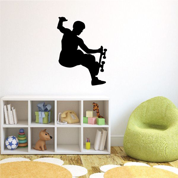 Skateboarding wall decal with a black silhouette skateboarder