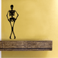 Skeleton legs-crossed decal with hands on hips, black outline design.