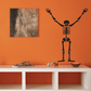 Skeleton hands up wall decal, black cartoon outline and arms raised.