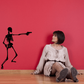 Skeleton hold-up wall decal silhouette of a dancing skeleton with raised arms