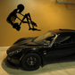 Skeleton holding knees wall decal, black silhouette