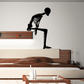 Sitting skeleton wall decal silhouette, black, with posed legs and arms