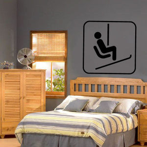 Chair lift wall decal with black seated icon in a white rounded square