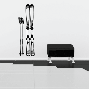 Ski poles and skis decal with black skis and pole line art on a light surface