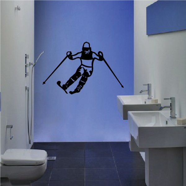 Skiing wall decal of a black skier with poles on a wall