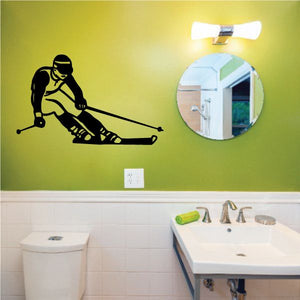 Skiing wall decal showing a black silhouette skier with ski poles