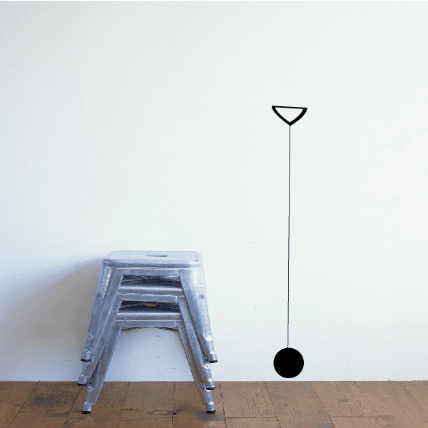 Wall decal with thin vertical line, outlined triangle top and black circle bottom