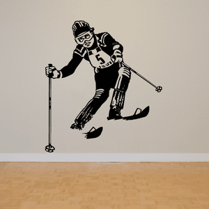 Skiing wall decal: black skier kneeling with ski poles and boots