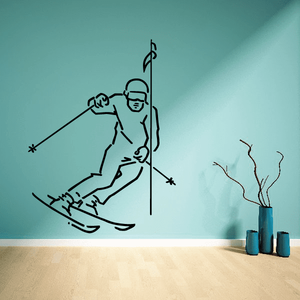 Skiing vinyl wall decal showing a black outline skier with skis and poles.