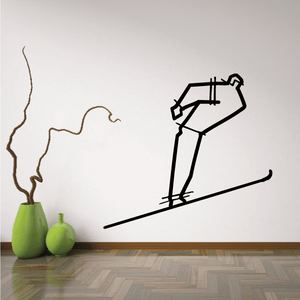 Vinyl skiing wall decal with black skier figure and long skis, single silhouette design.