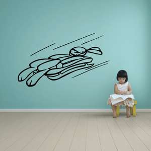 Ski racing vinyl wall decal with black skier illustration in motion lines