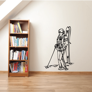 Skiing wall decal showing a black outline skier with skis and poles
