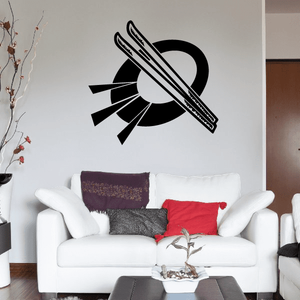 Skiing wall vinyl decal of crossed black skis over white circular mark