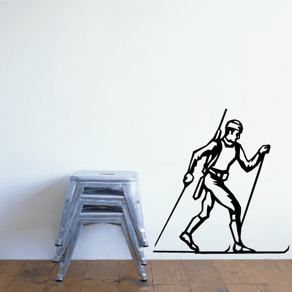 Skiing wall decal vinyl sticker of a skier with poles and skis