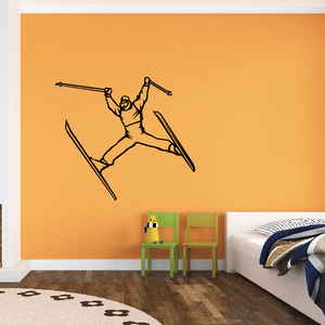 Skiing wall decal featuring a black skier silhouette with two skis