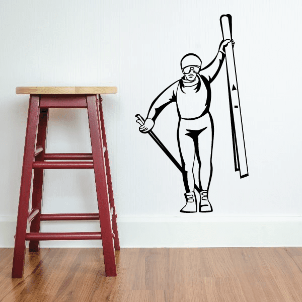 Skiing wall decal vinyl sticker of a skier with skis and poles, black outline.
