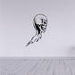 Black vinyl skull wall decal with flame-style details below