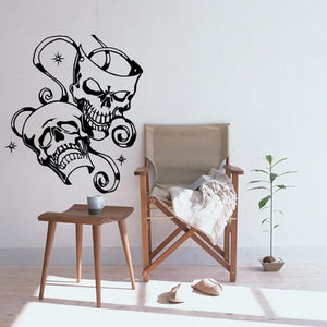 Skull vinyl wall decal with two skulls wearing headphones and stars