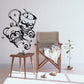 Skull vinyl wall decal with two skulls wearing headphones and stars
