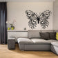 Black skull wall decal with butterfly-like wings and mirrored skull faces