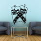 Vinyl skull wall decal of two crossed skulls with stars and ribbon shapes