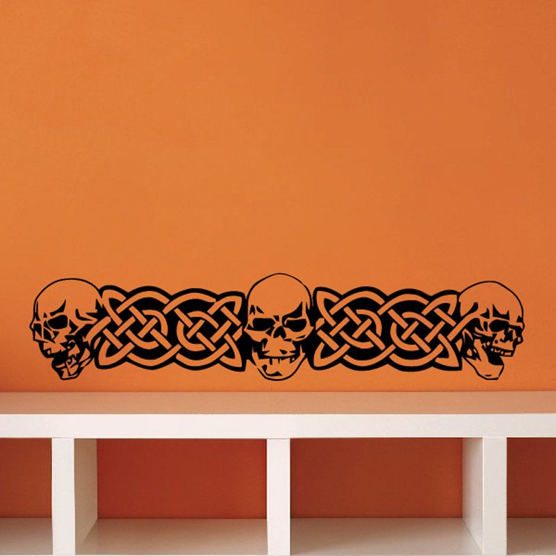 Black vinyl skull wall decal with celtic knot design and side skulls