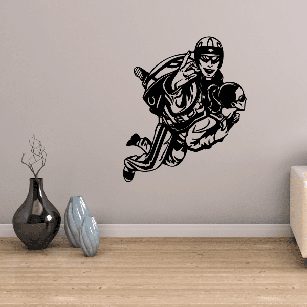 Skydiving couple wall decal with dark line art: jumper holding partner midair