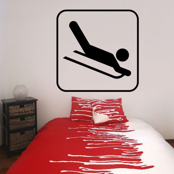 Sledding sign decal with black border and sledding icon on light background