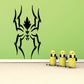Black slithering spider decal with jagged legs and flame-like center