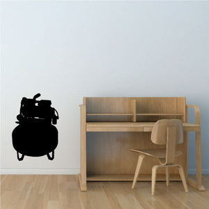 Small air compressor decal with black silhouette of a portable tank