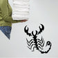 Black stylized scorpion decal with raised claws and segmented tail