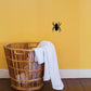 Crawling spider wall decal, black with legs splayed