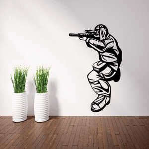 Sniper paintball player vinyl decal, black-and-white figure aiming paintball gun.