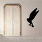 Black snow owl silhouette fluttering in flight decal