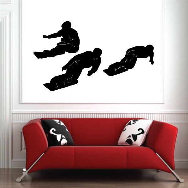 Black snowboard wall decal with three action rider silhouettes