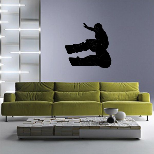 Snowboard wall decal with black snowboarder silhouette riding snowboard