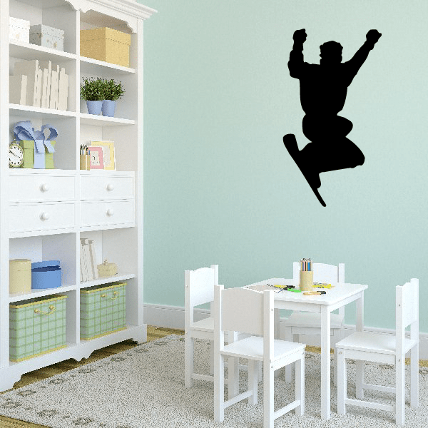 Snowboarding wall decal, black silhouette snowboarder jumping on the wall