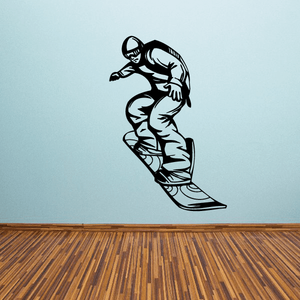 Snowboarding vinyl wall decal of black snowboarder silhouette in motion