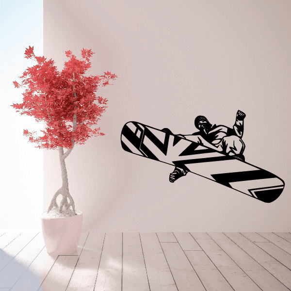 Snowboarding wall decal with black snowboarder silhouette on board, vinyl style