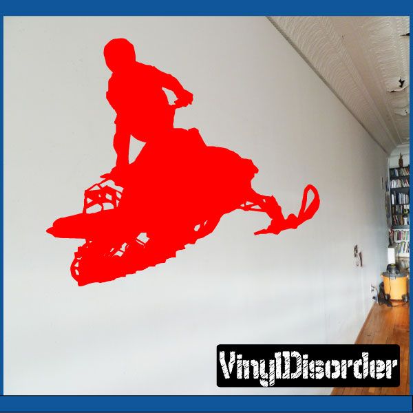 Red snowmobile jumping decal with rider silhouette, bold graphic