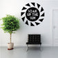 Black sunburst wall decal reading 'SOAK UP THE SUN'.