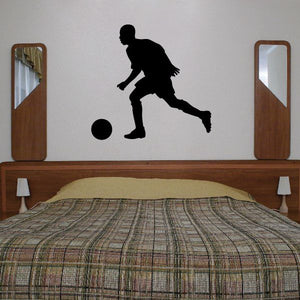 Black soccer player wall decal kicking a ball silhouette