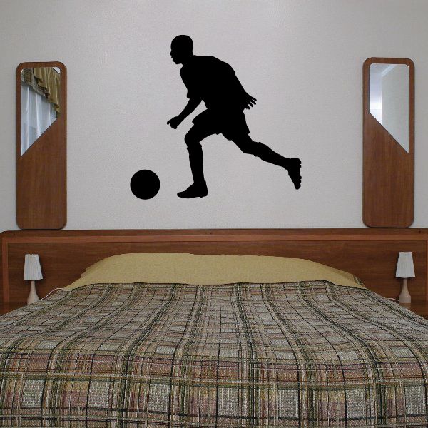 Black soccer player wall decal kicking a ball silhouette