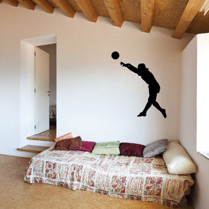 Soccer player wall vinyl decal, black silhouette jumping with ball